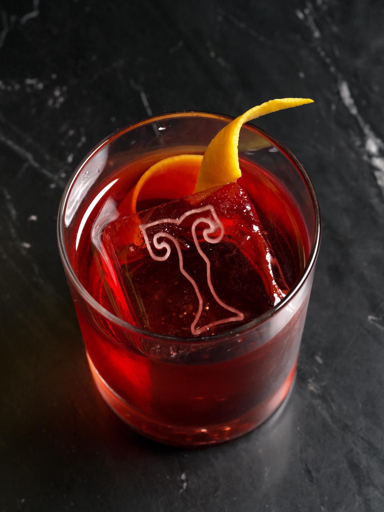 A Smoked Old Fashioned with the Tenderloin Room monogram etched in the ice